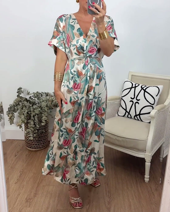 Elegantes Kleid mit V-Ausschnitt und Twist-Muster im Botanischen Druck