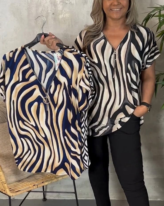 Modische bluse mit V-ausschnitt und reißverschluss im zebra-print