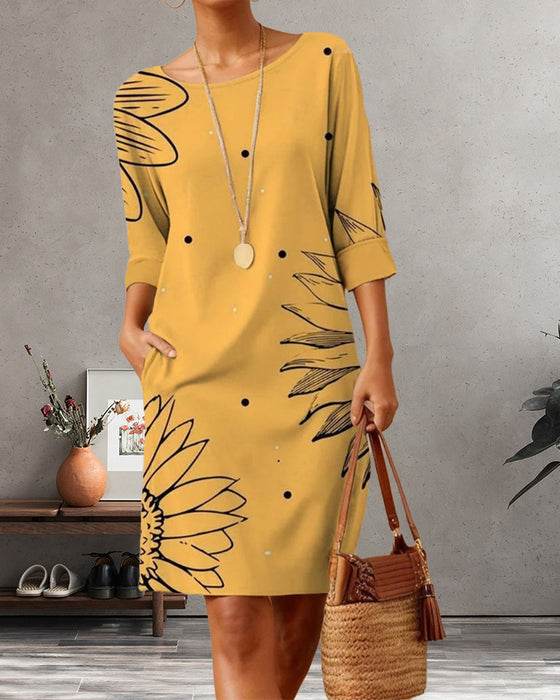 Elegantes kleid mit sonnenblumen-print und tasche